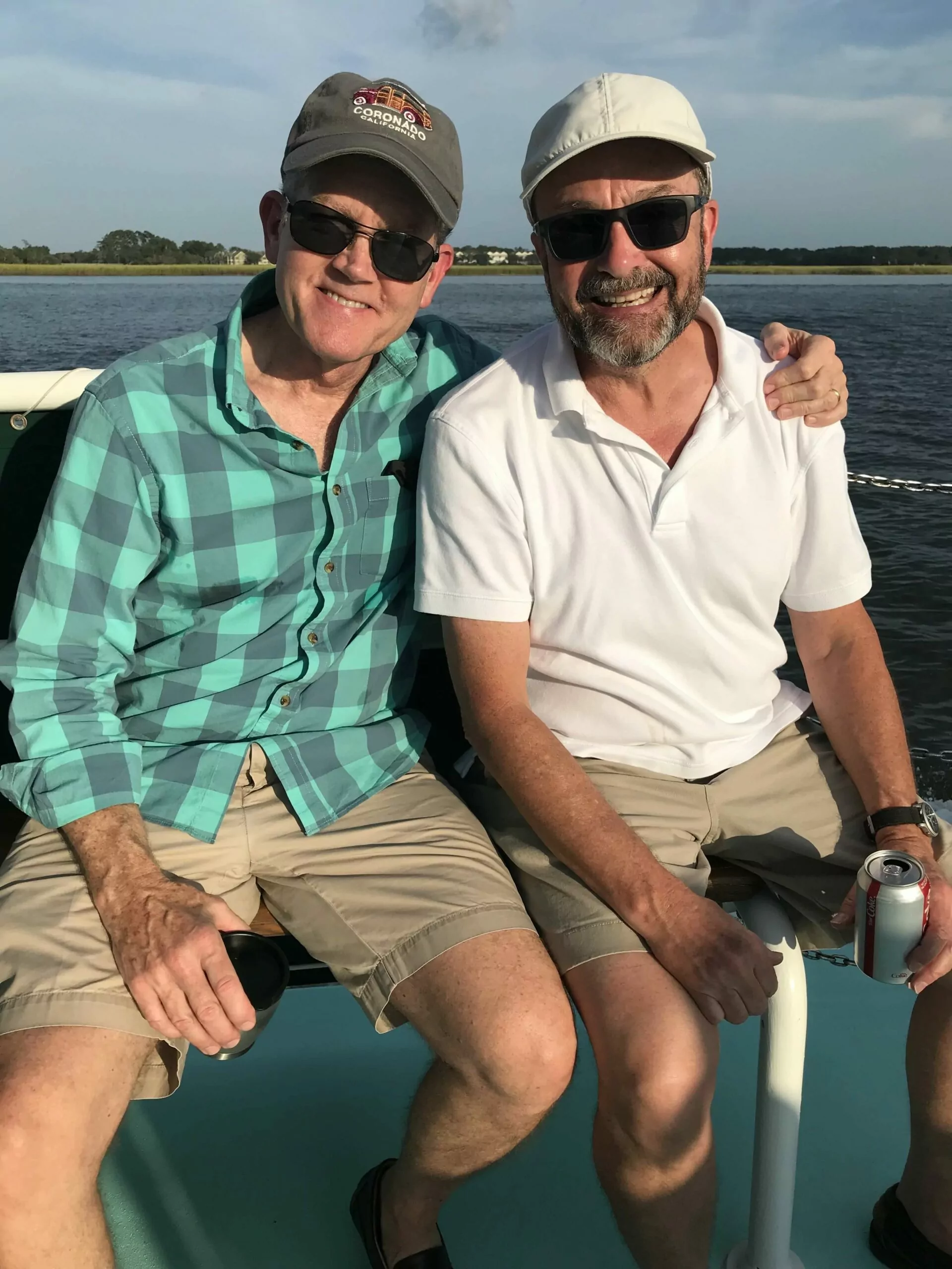 men with beer cups in hands, relaxing and chilling on boat tour